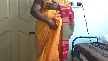 Indian Wife In Orange Saree Teasing With Big Boobs And Shaved Pussy